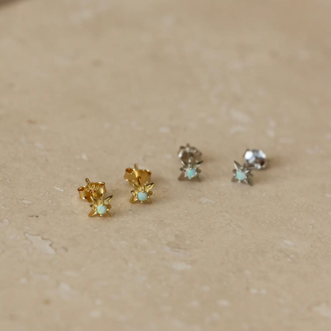 Starburst gold stud earrings with opal