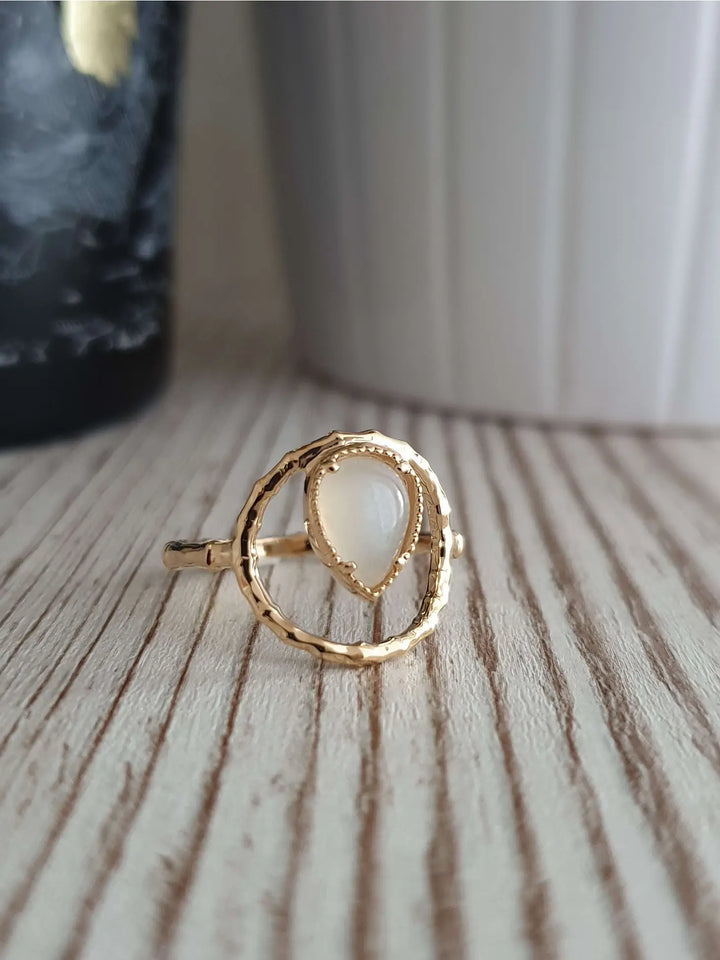 Gold plated ring with a moonstone teardrop shape