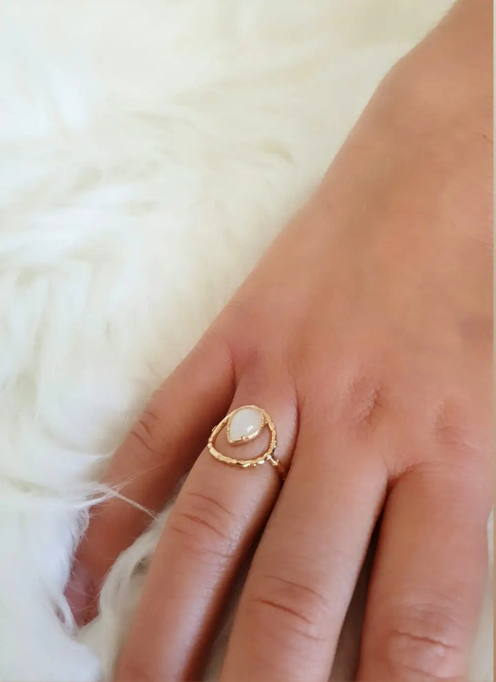 Gold plated ring with a moonstone teardrop shape