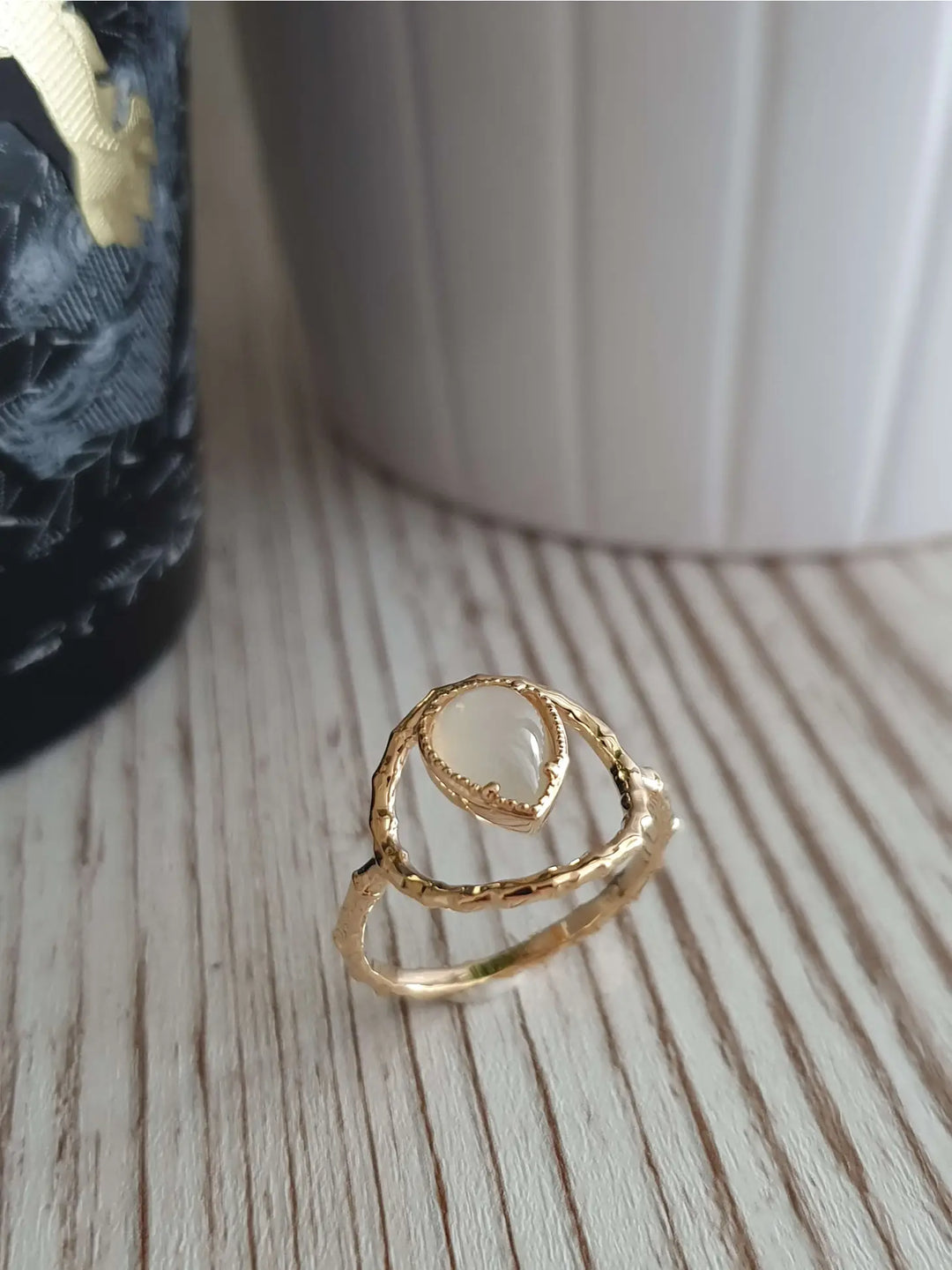 Gold plated ring with a moonstone teardrop shape