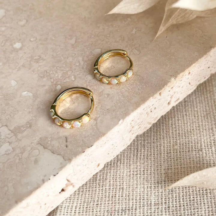 Gold opal huggie hoops