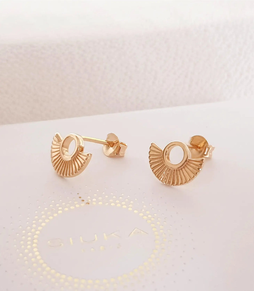 Gold-plated earrings with rays