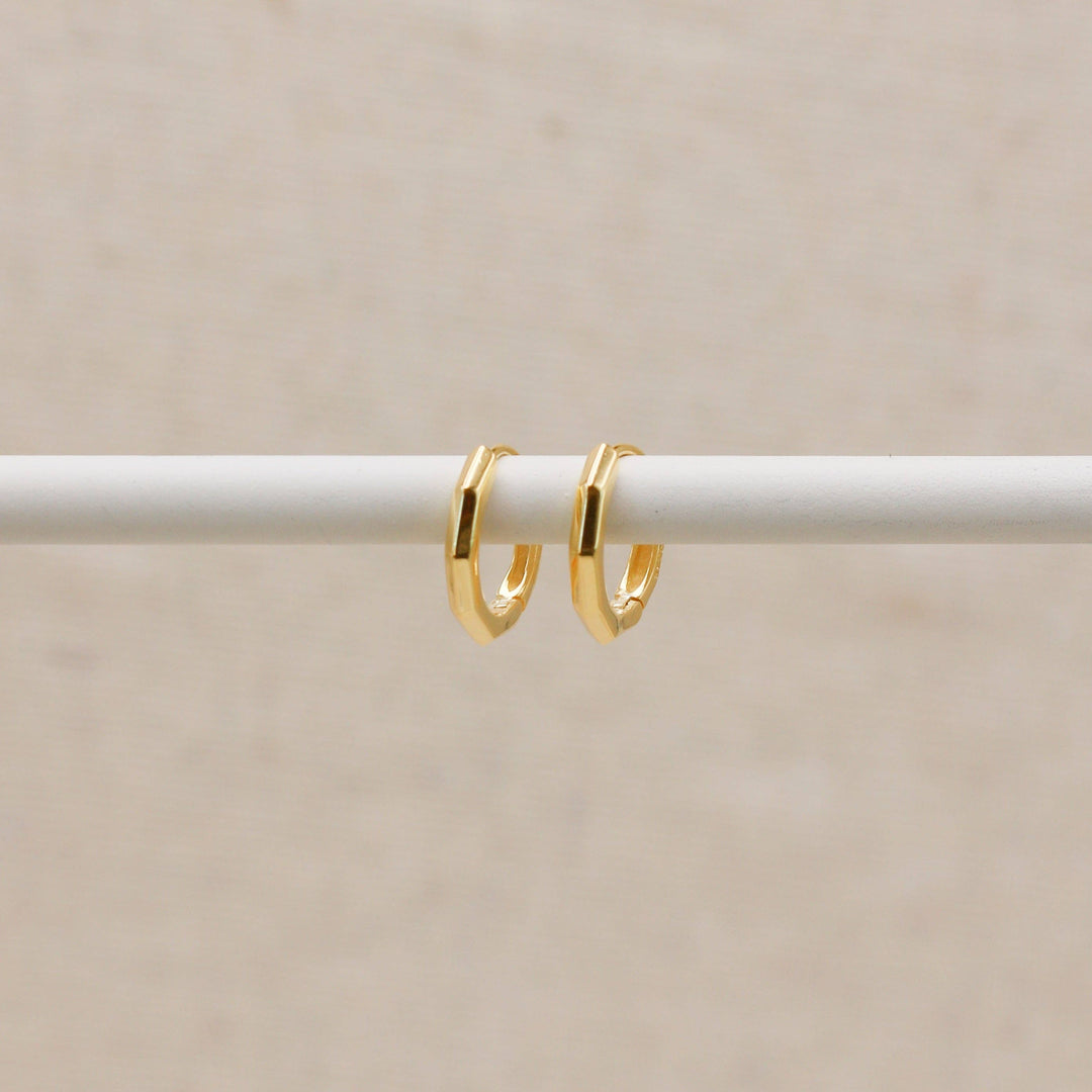 Huggie hoops with gold-colored beveled edges