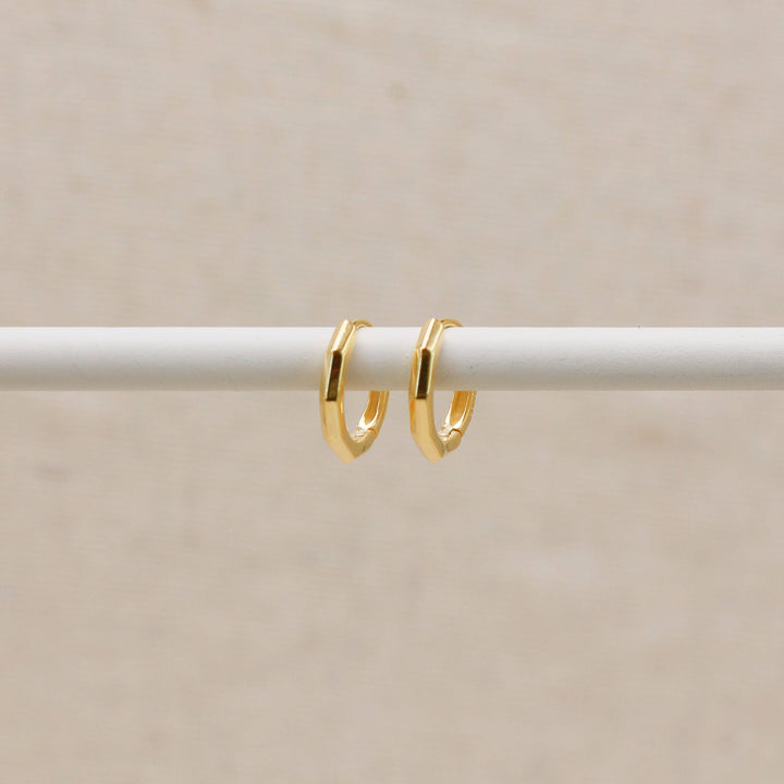 Huggie hoops with gold-colored beveled edges